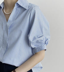 Blue and white striped shirt top