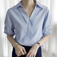 Blue and white striped shirt top