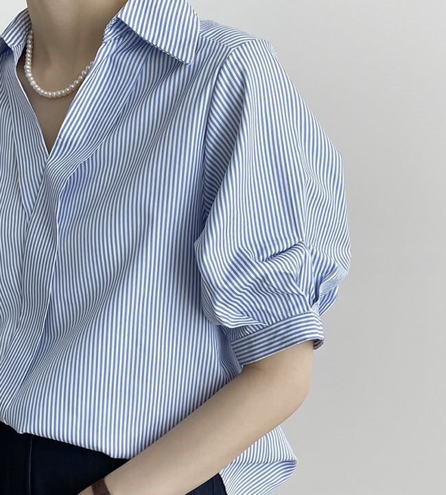 Blue and white striped shirt top