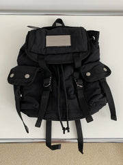 Relaxed and versatile metal-stamped nylon backpack schoolbag