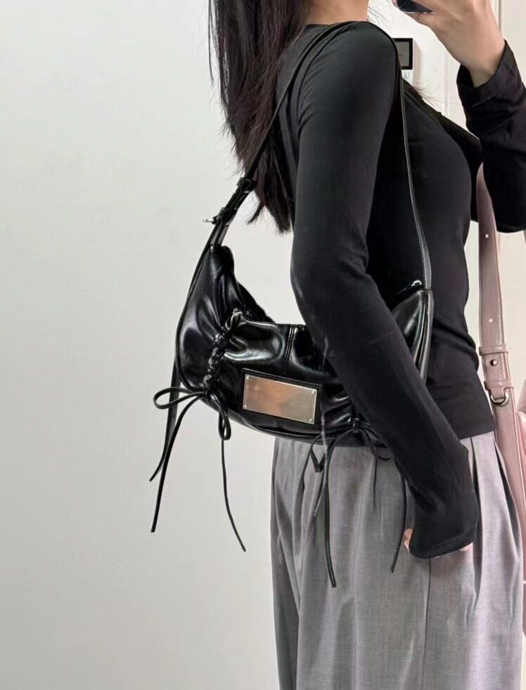 Bow tie drawstring shoulder bag
