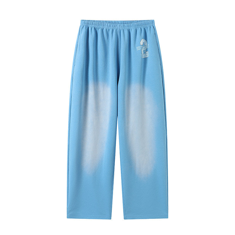 Washed and distressed printed loose blue jogging pants