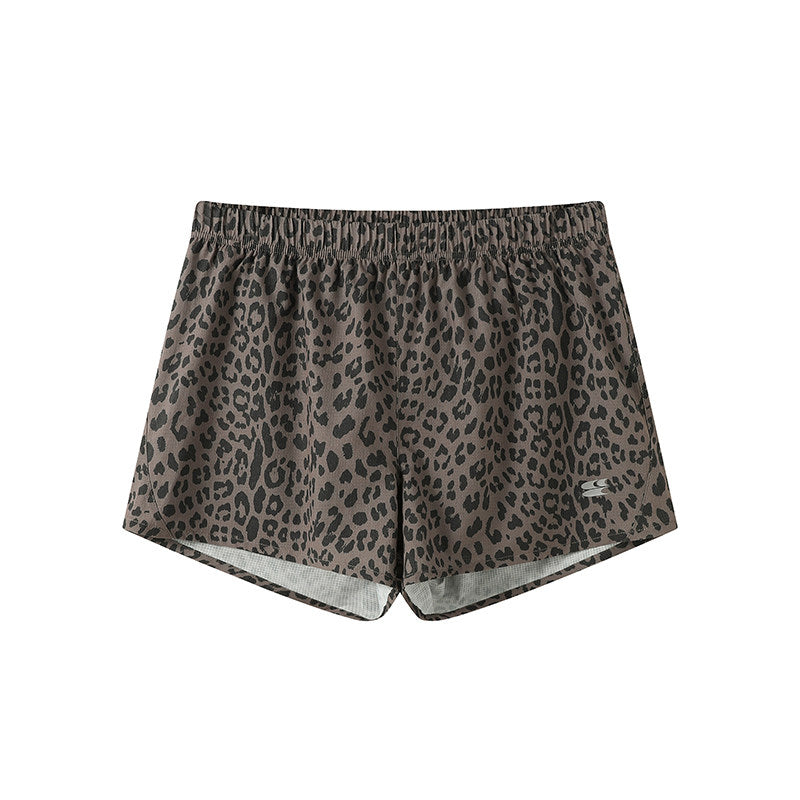 Printed athletic shorts with check pattern, leopard print and floral design, featuring an inner lining