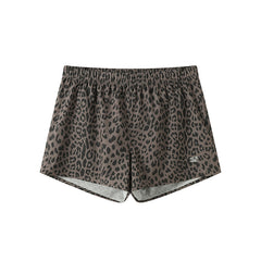 Printed athletic shorts with check pattern, leopard print and floral design, featuring an inner lining