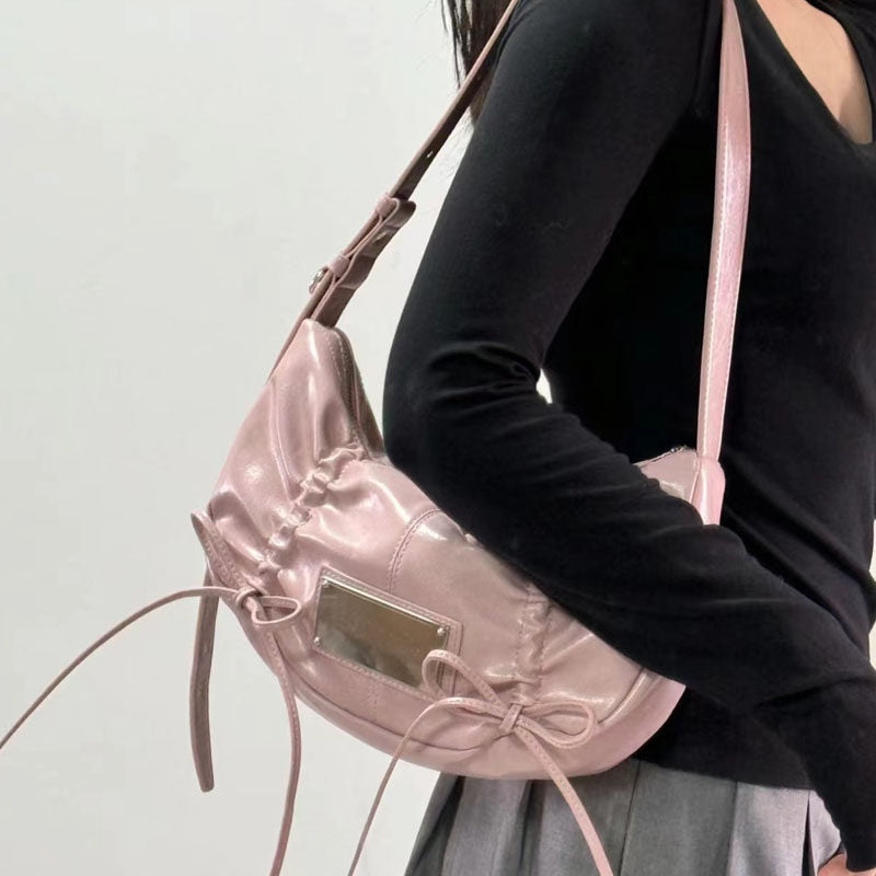 Bow tie drawstring shoulder bag
