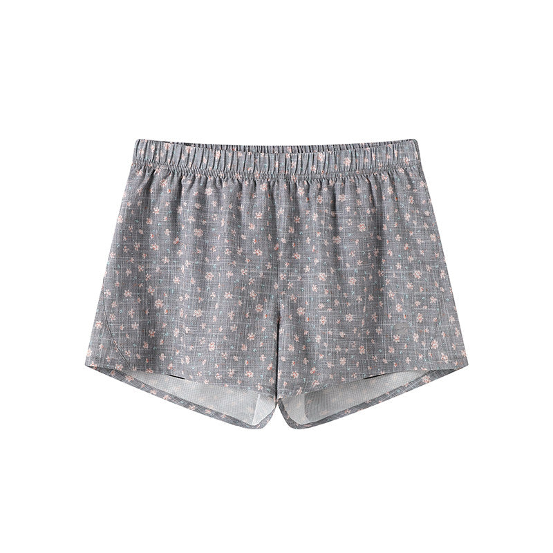 Printed athletic shorts with check pattern, leopard print and floral design, featuring an inner lining